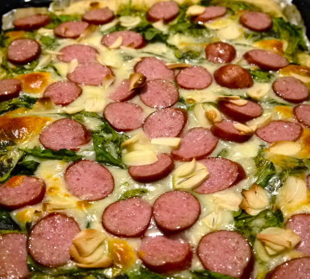 Monday Night Pizza – Baby Spinach, Smoked Sausage, Pesto, Roasted Garlic and Mozzarella